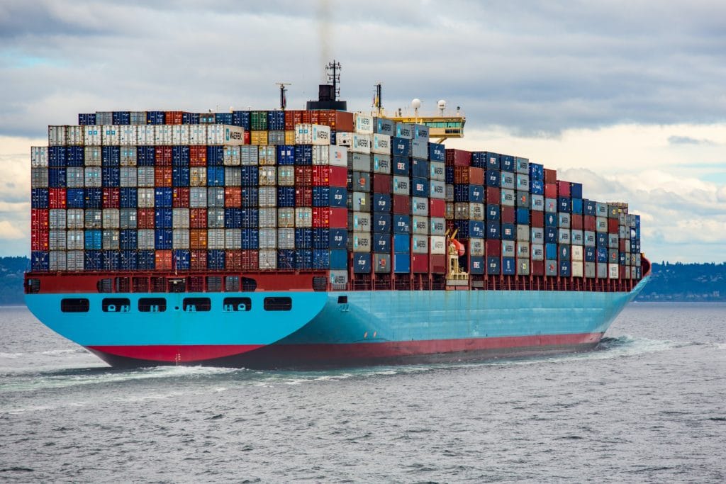 cargo ship with containers stacked high